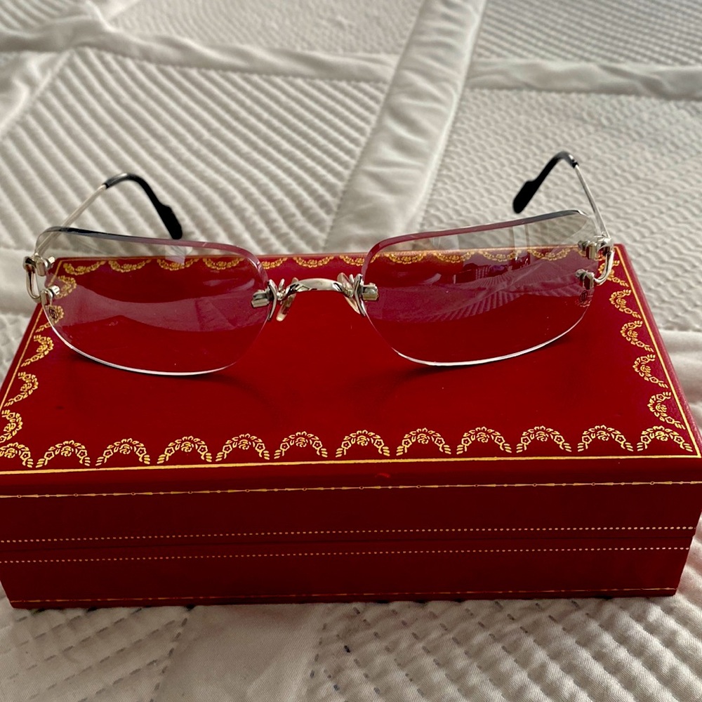 Smokey lens rimless Cartier glasses